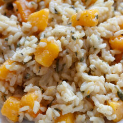 Butternut squash risotto served in a white serving dish