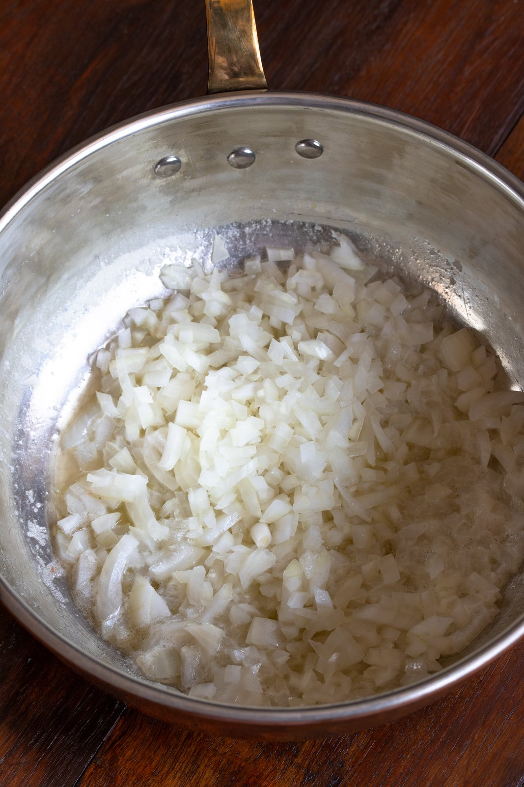 Onion cooking in a pan until translucent