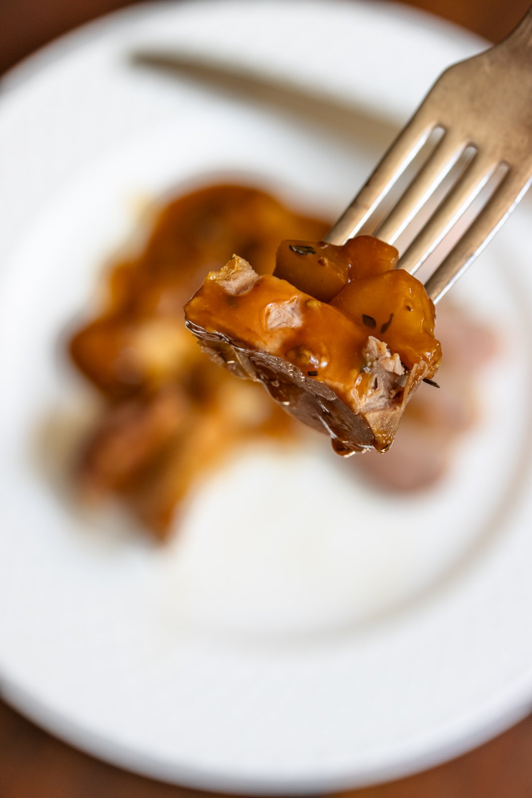 Duck on a serving spoon, close up. 