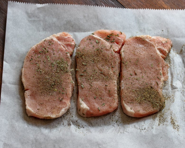 Boneless pork chops seasoned with salt, pepper and dry sage
