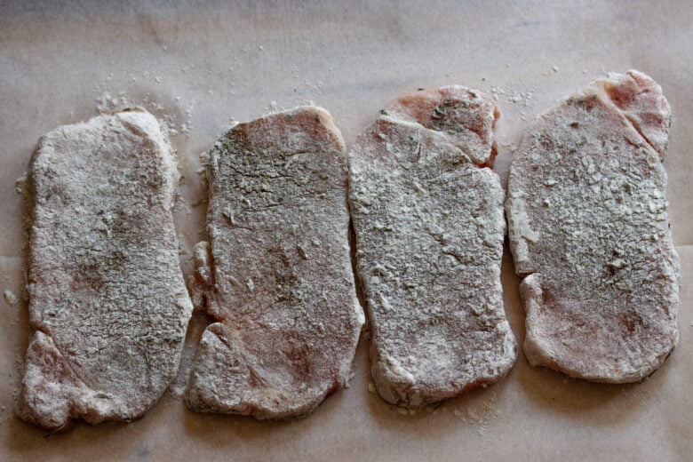 Chops dredged into flour.