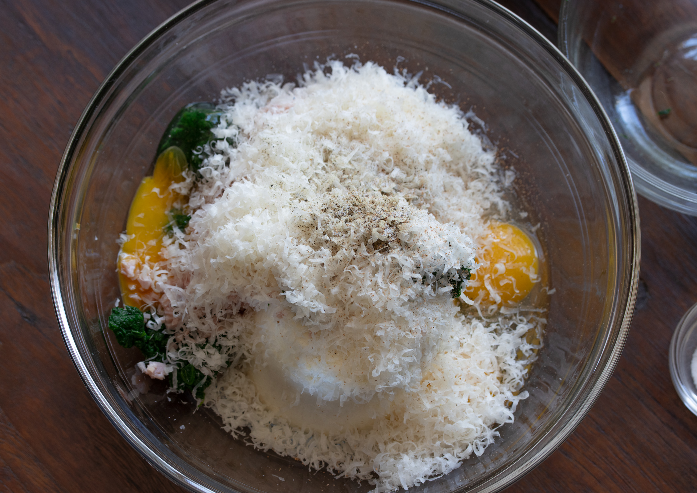 Ingredients assembles in a mixing bowl for the cannelloni filling.