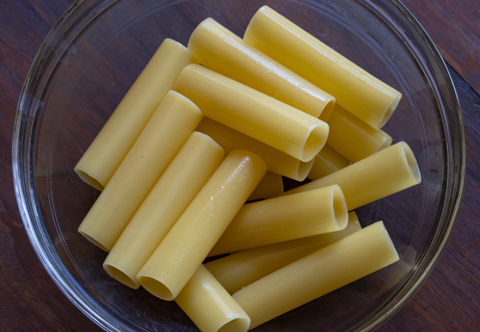 Part cooked cannelloni ready to be filled.