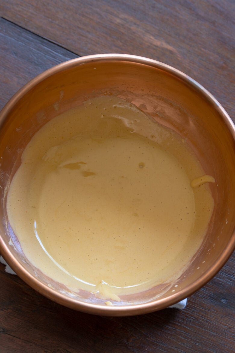 Almost ready zabaglione in a copper mixing bowl. 