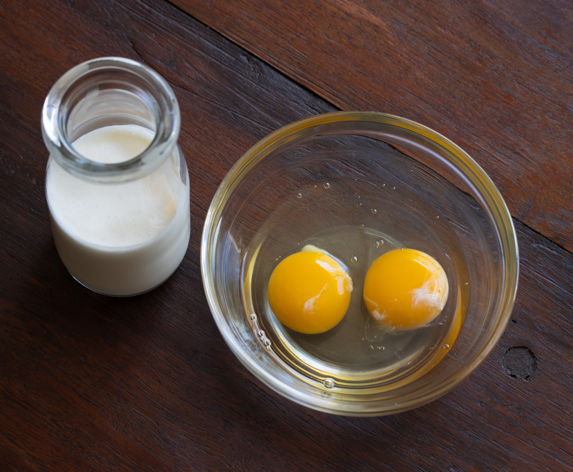 eggs and heavy cream in glass contaienrs