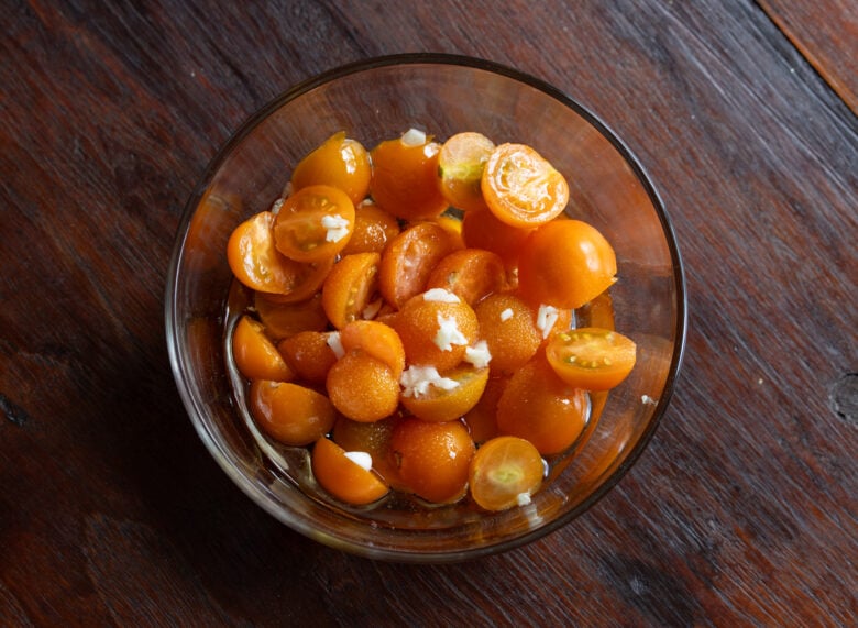 Cherry tomatoes with olive oil and finely chopped garlic.