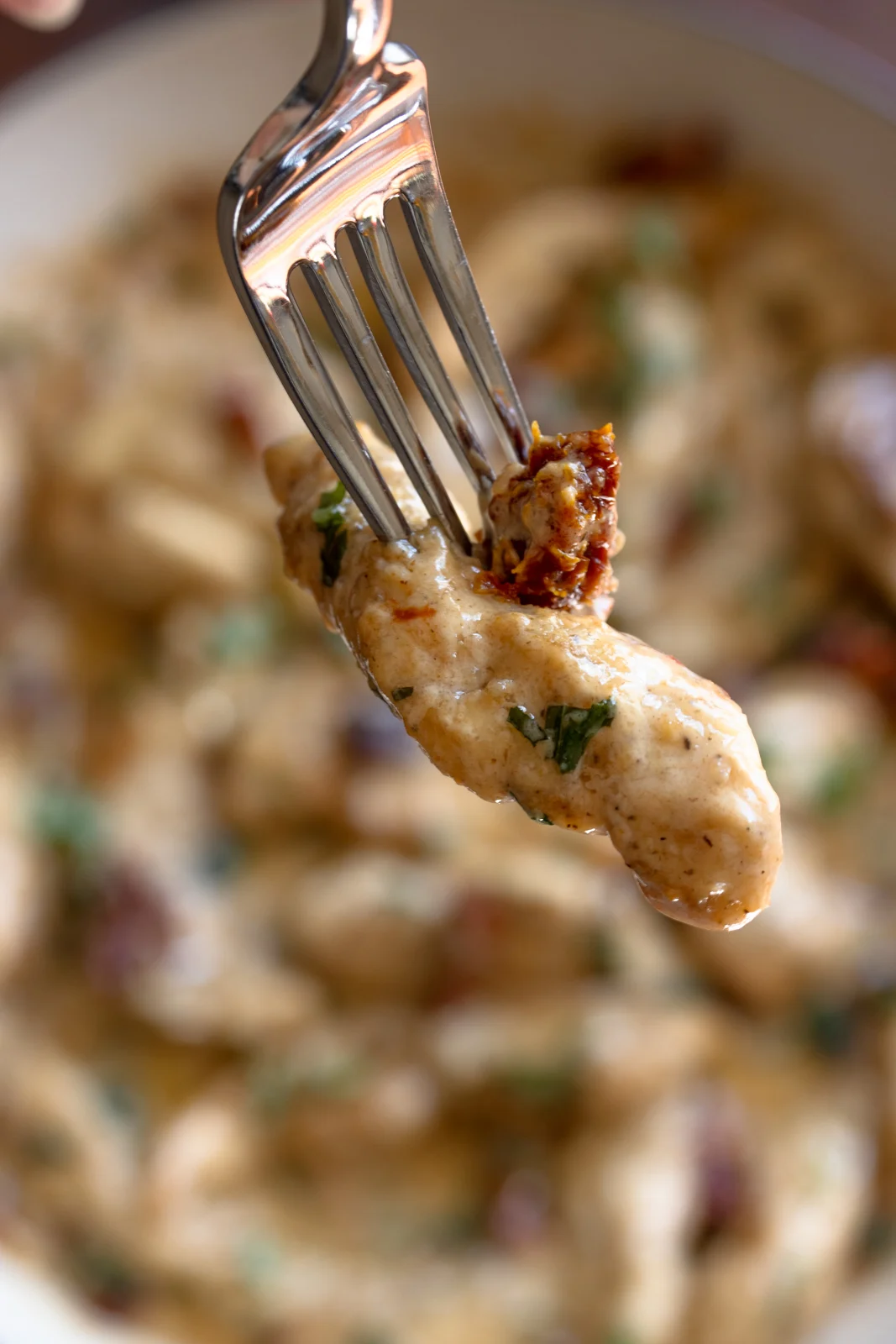 Forkful of chicken strip ready to be enjoy!.