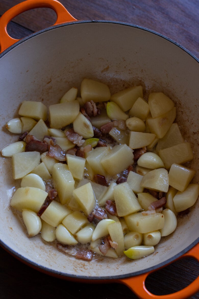 Potatoes, garlic and bacon all cooked.