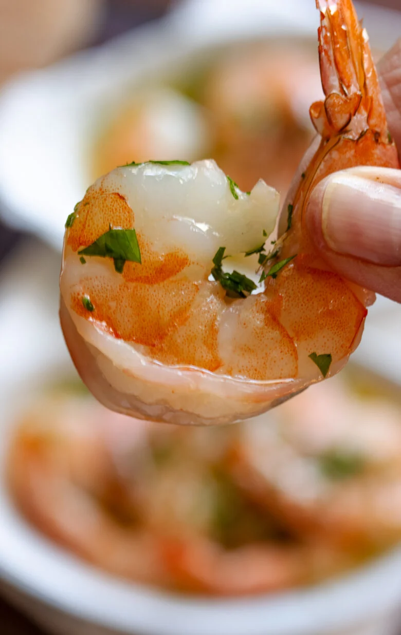 Cooked garlic butter shrimp close up.