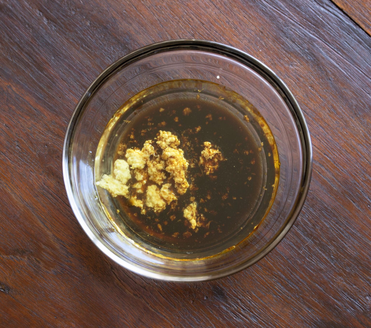 Ginger and soy sauce together to be whisked.
