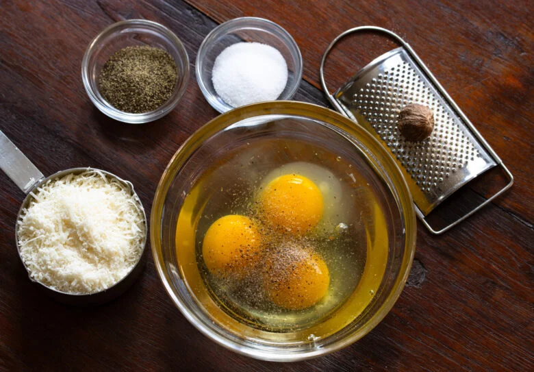 Eggs, cheese, salt, pepper and nutmeg mixed to create this soup.