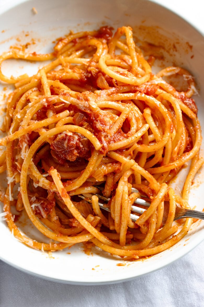 Close up of the bucatini amatriciana with fork.