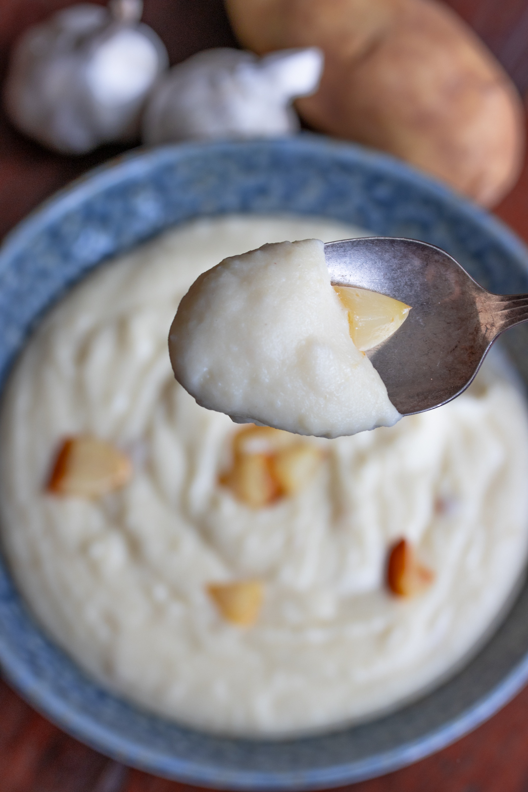 A spoonful of garlic mashed potatoes.