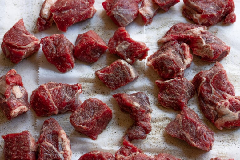 Beef seasoned generously with salt adn pepper.