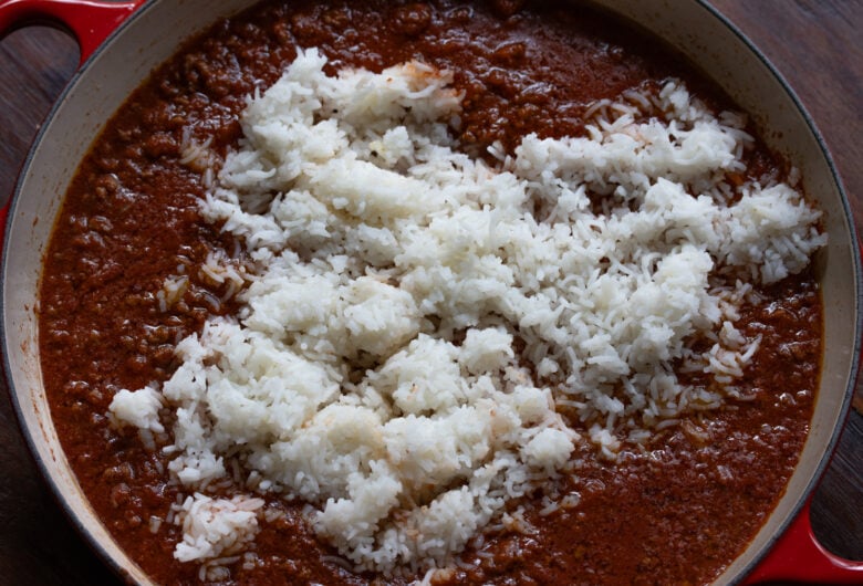 Cooked rice added to teh tomato sauce. 