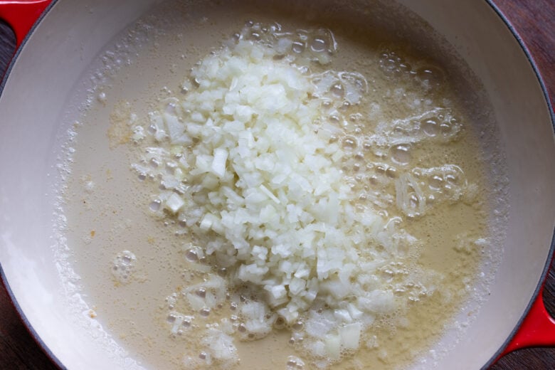 Minced onions added to teh skillet.