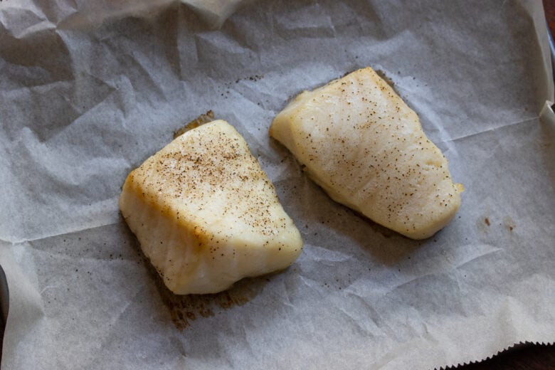 Baked sea bass with a small crust formed on top.