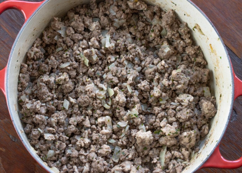 Meat fully cooked and broken down to small pieces.