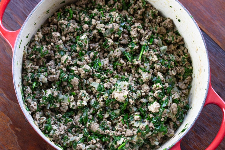 Spinach added to the meat mixture and mixed well.