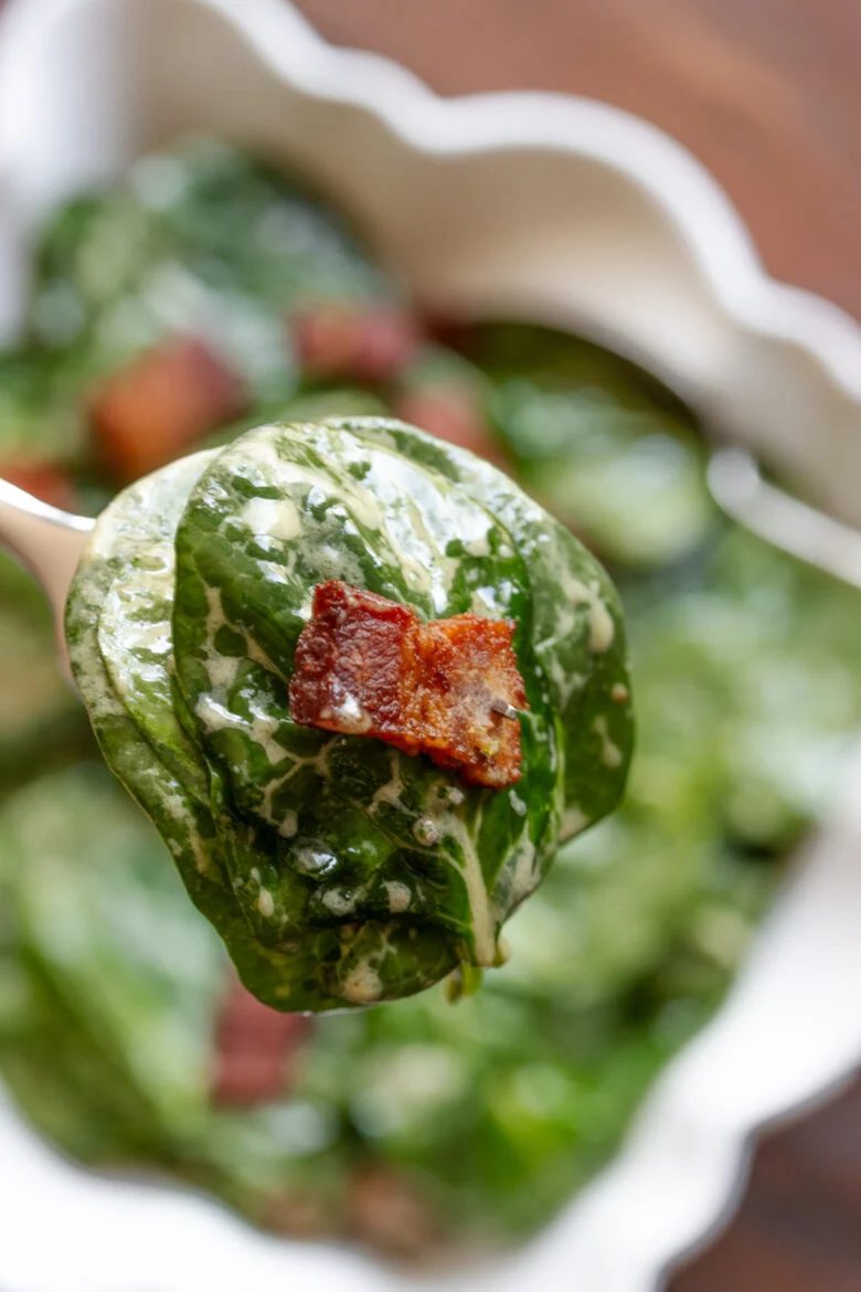 A serving fork of psinach and bacon ready to be enjoyed. 