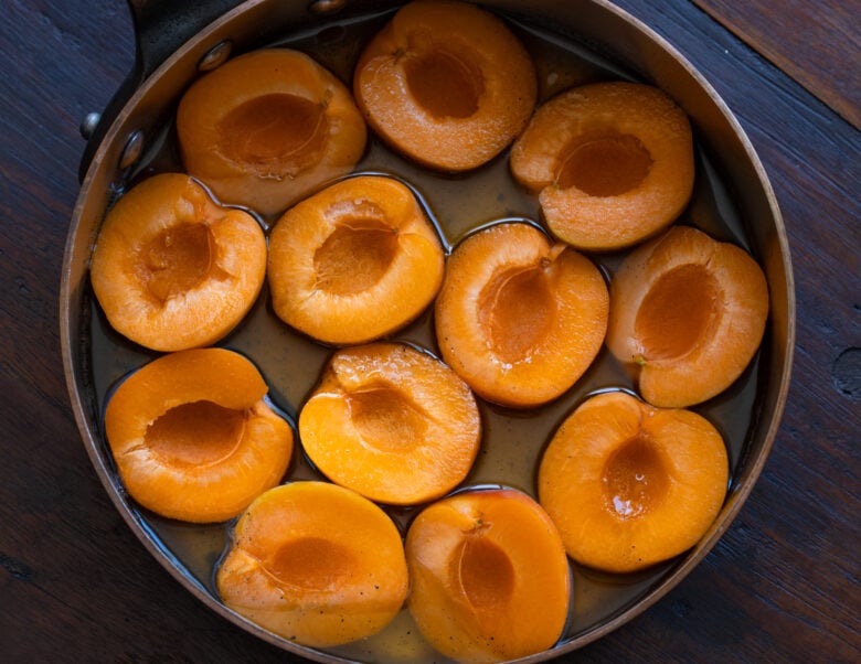 Apricots placed into saucepan to cook with the syrup and soften. 