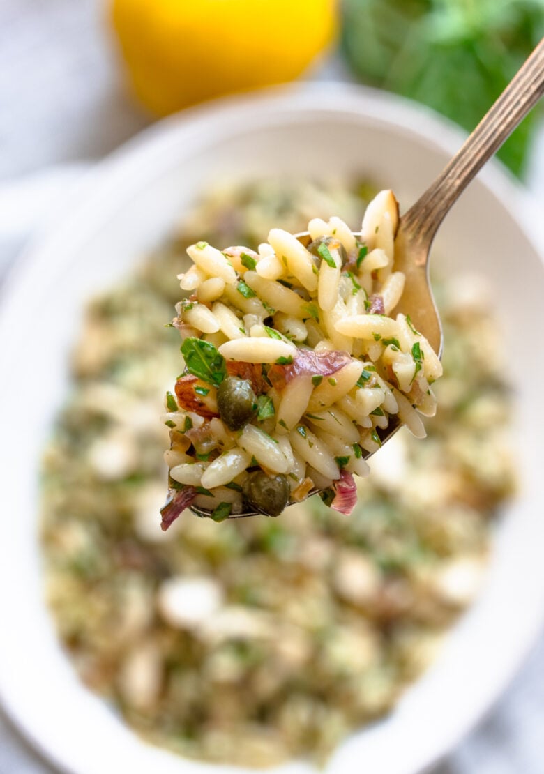 Close up spoonful of this mediterrean orzo salad.