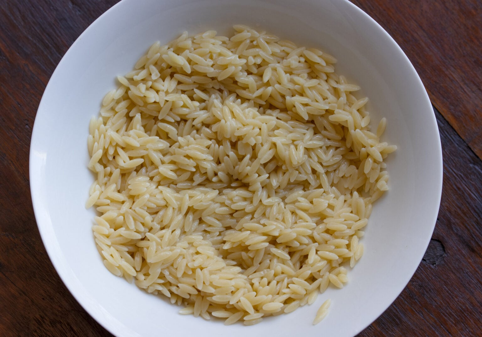 Orzo pasta cooked, drained and with olive oil sprinkled over to cool off. 