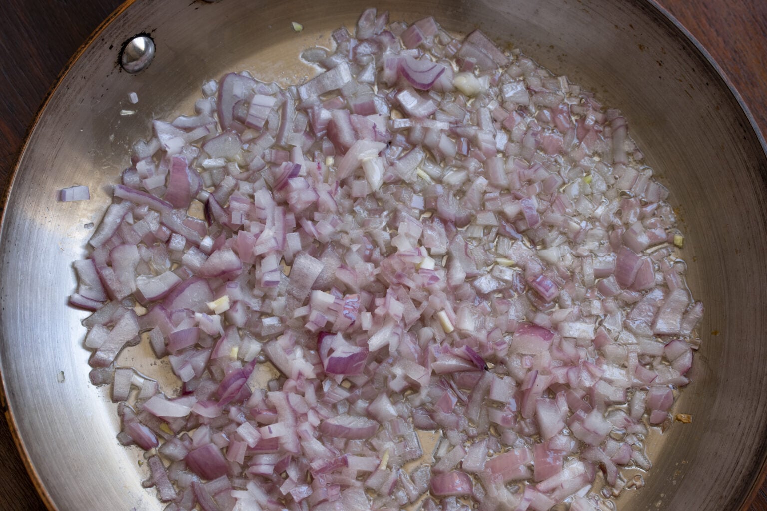 Red onions finely chopped softened with butter and olive oil in a skillet. 