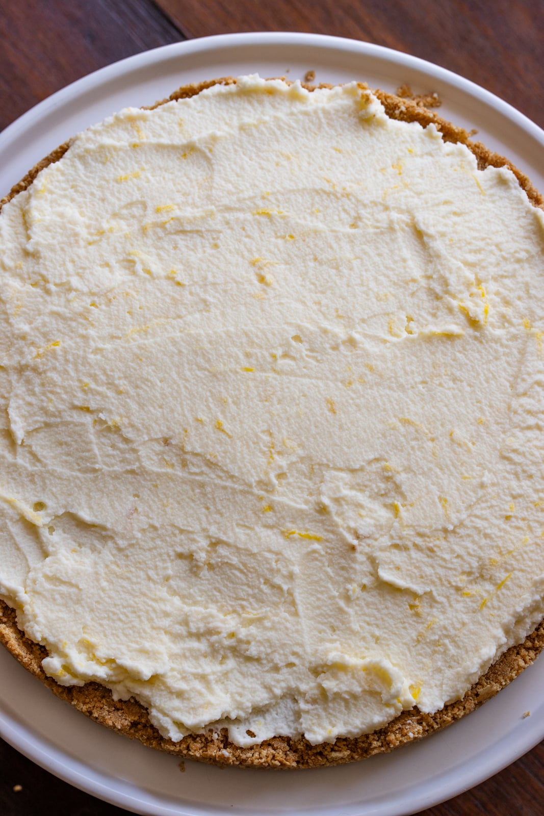 Whipped cream with mascarpone spread over the graham cracker base. 