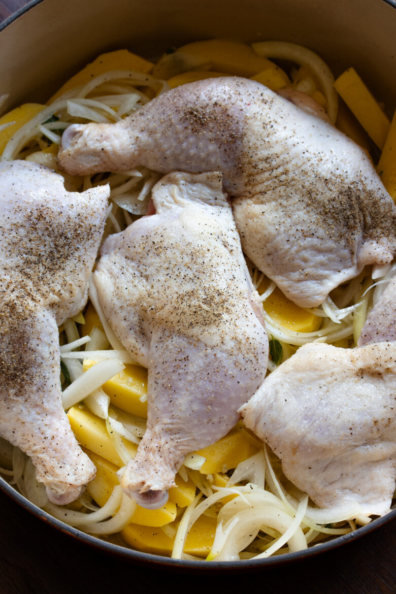 Leg quarter well seasoned with salt and pepper and placed over the potatoes in a Dutch oven.