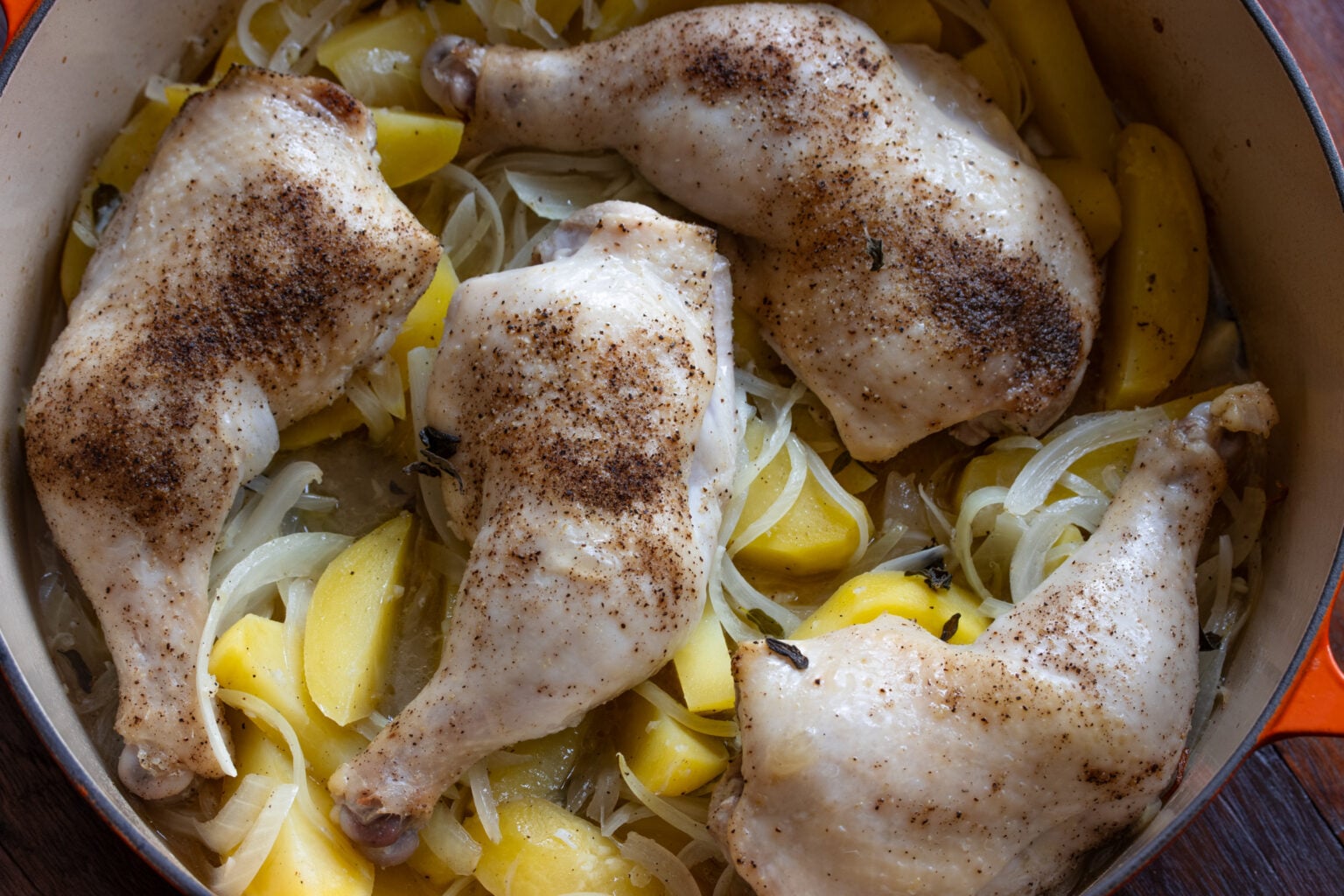 Halfway cooked potatoes are not cooked uncovered until the chicken reaches 165F.