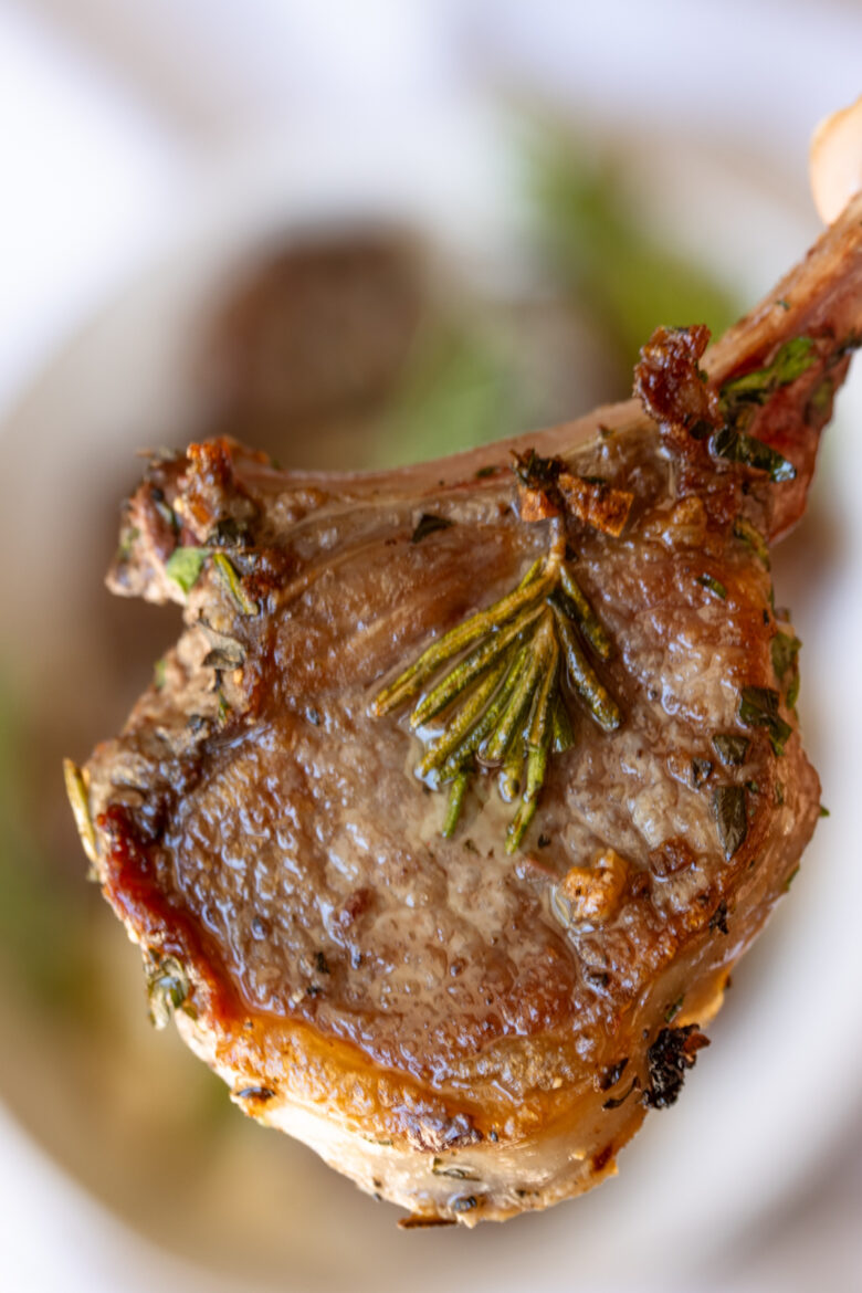Close up of a grilled lamb chop.