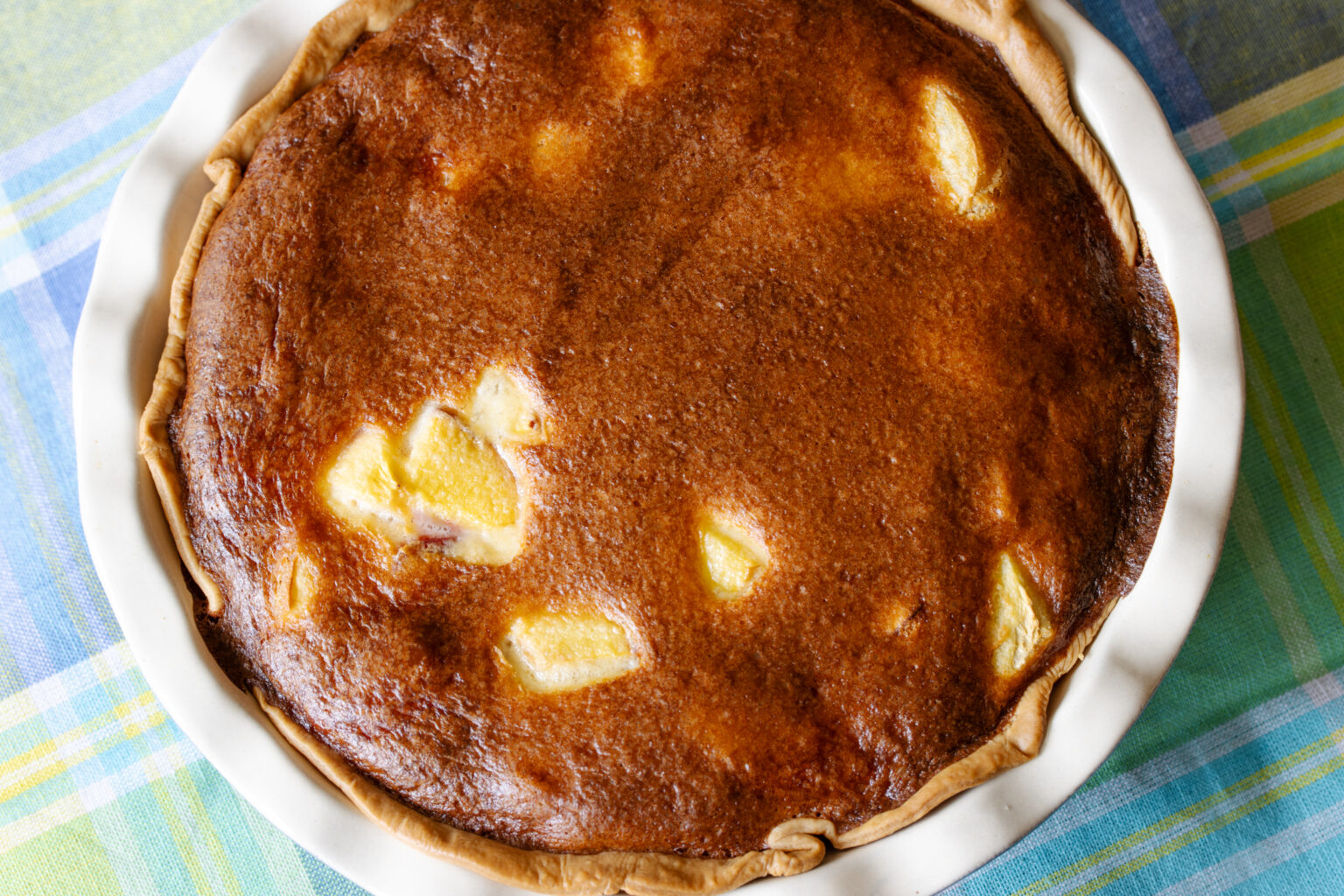 Peach pie out of the oven and ready to be enjoyed.