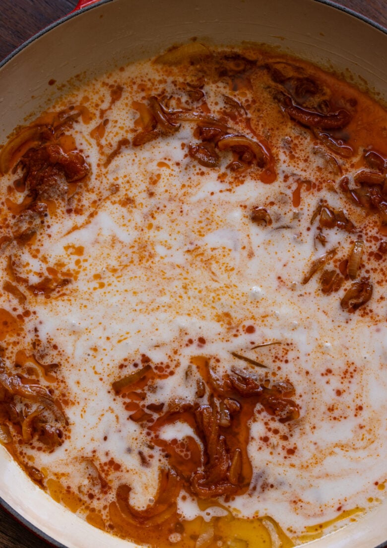 Coconut milk added to the curry onion mixture. 