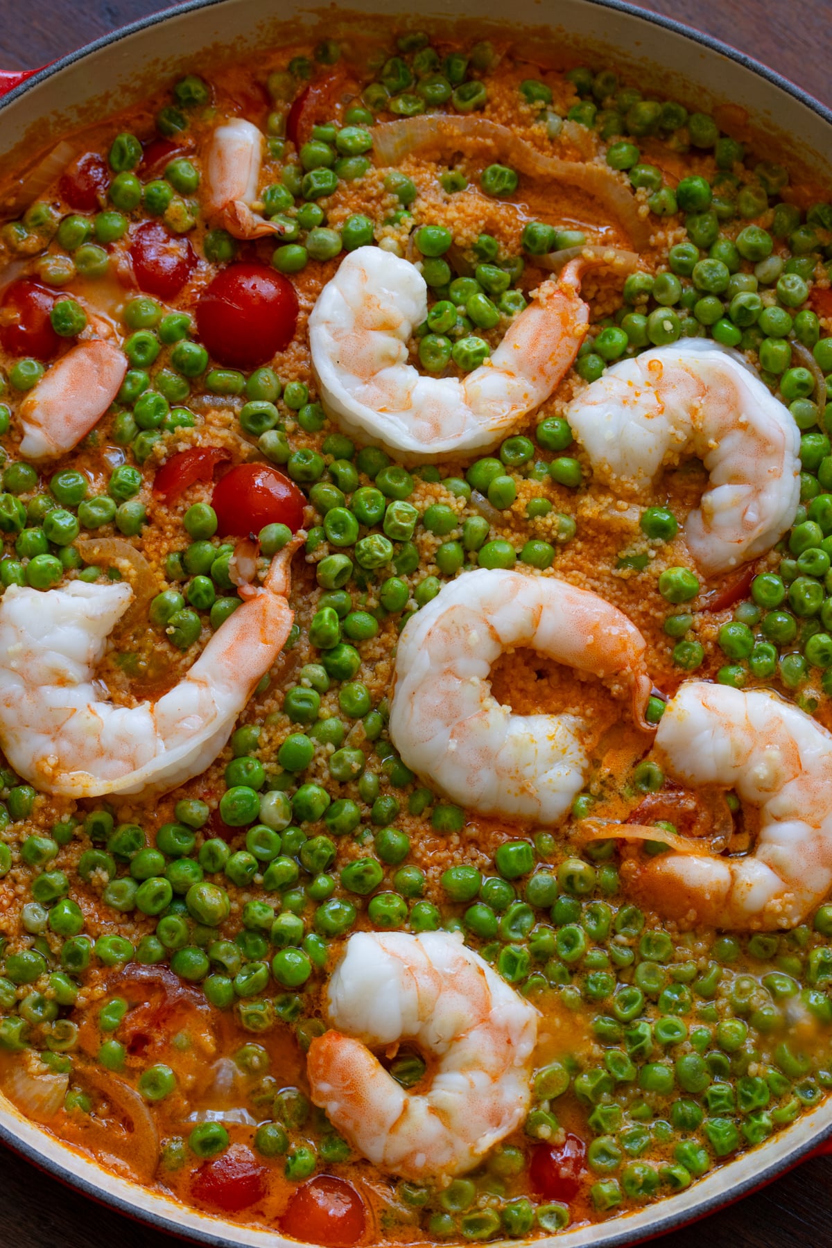 Shrimp and coconut curry with couscous in a skillet.