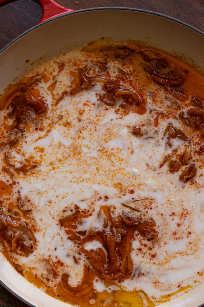 Coconut milk added to the curry onion mixture.