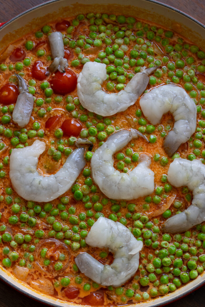 Shrimp added to the couscous, peas and coconut milk.