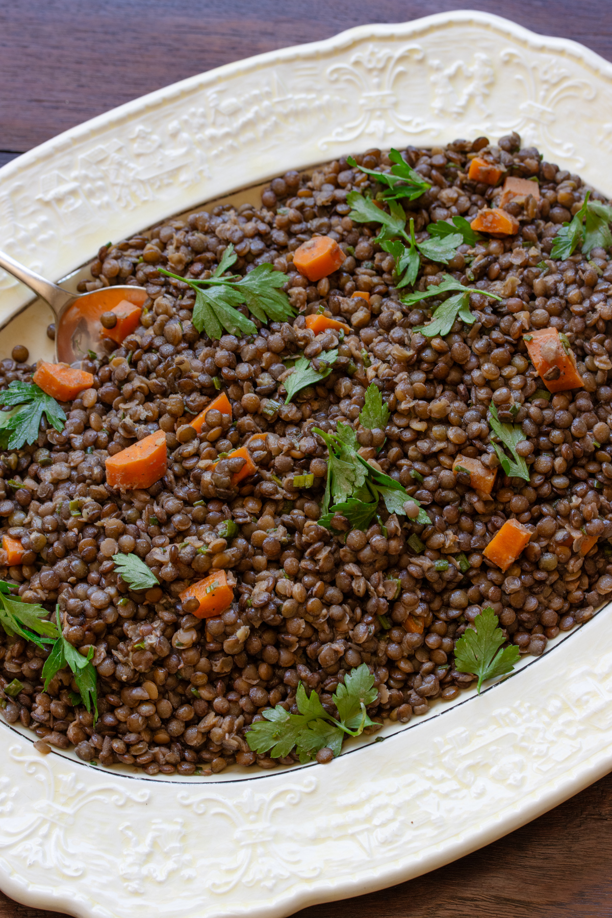French green lentils served in an oval white platter.