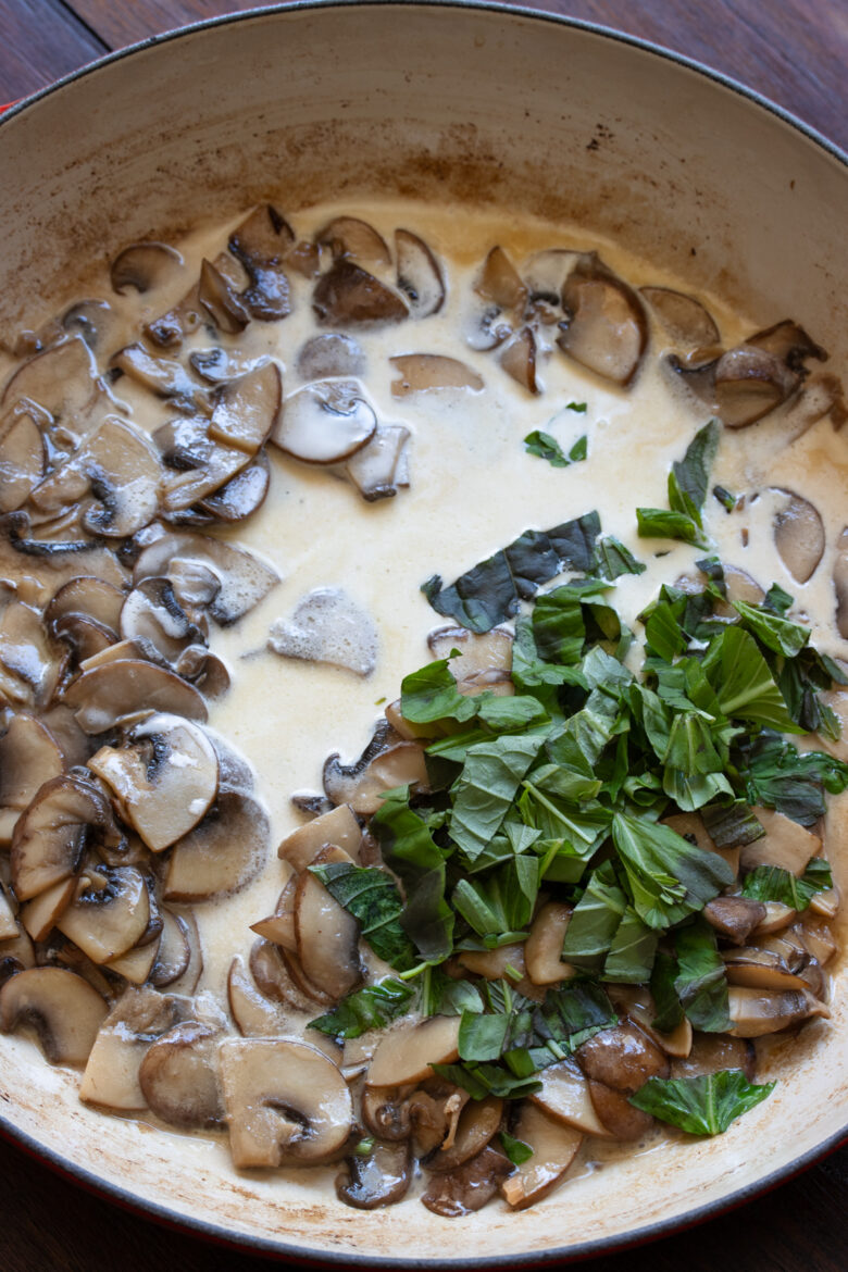 Wine, cream and basil added to the mushrooms to create the sauce for your salmon fillets.