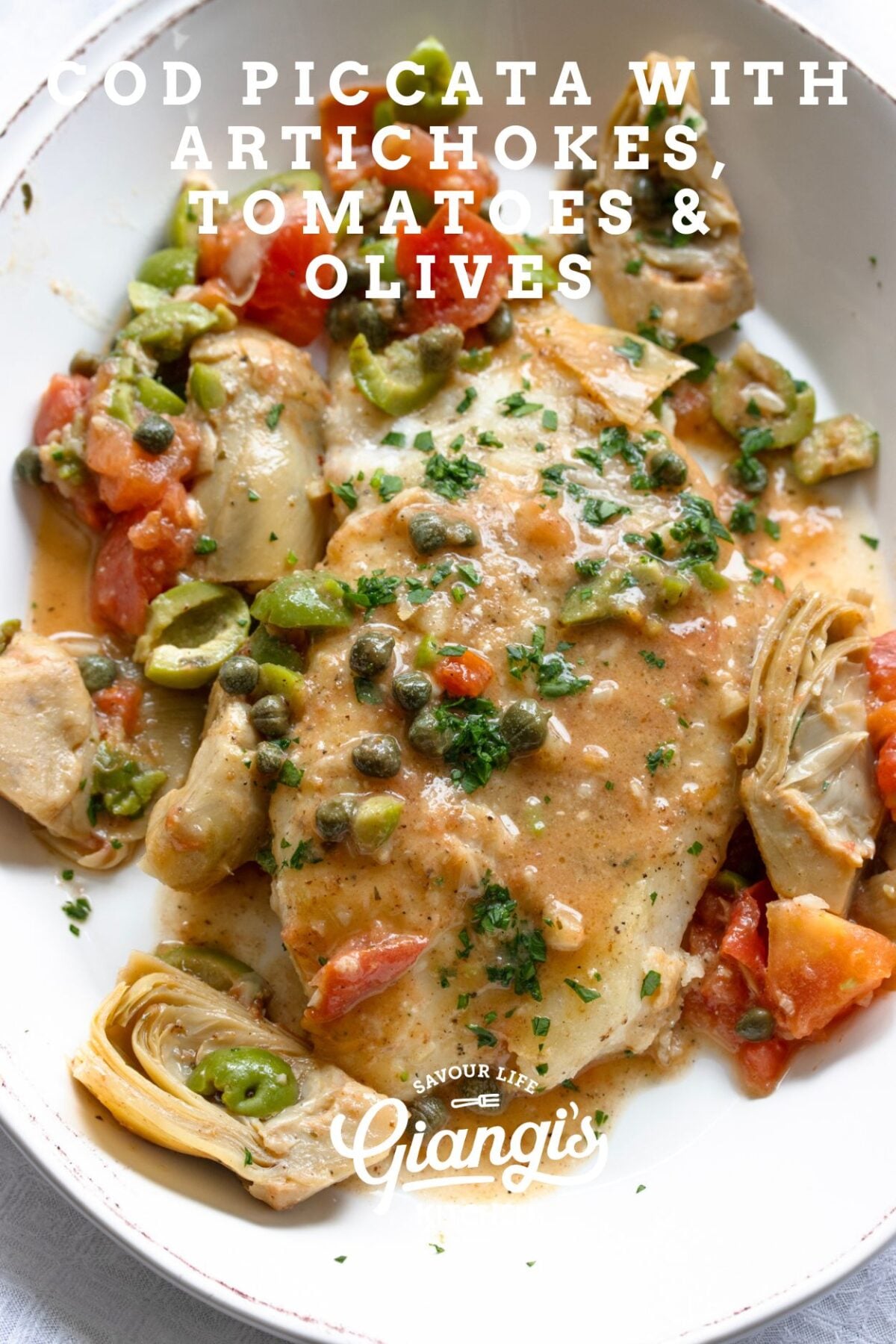 This easy cod piccata with artichokes, tomatoes, and green olives is ready in 20 minutes. Tender fish in a buttery lemon sauce. Perfect for dinner.